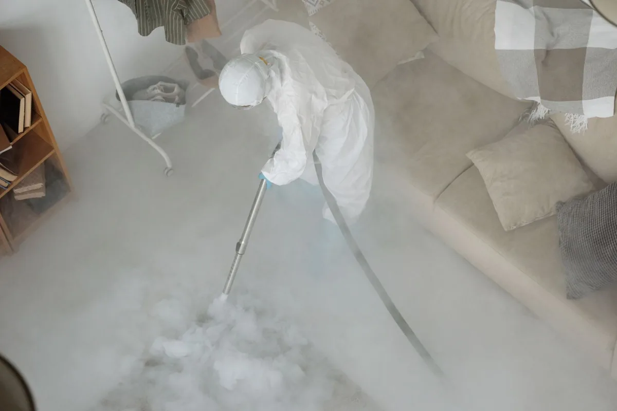 Biohazard cleanup technician in protective equipment, Hoboken, NJ